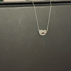 1/20 CT. T.W. Diamond Love Knot Pretzel Necklace in Sterling Silver - 17.5"